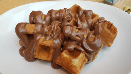 waffle chocolated hot  liquid on the plate