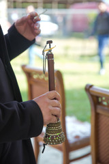 The man was holding a zurna in his hand . A man playing zurna traditional instrument in wedding .