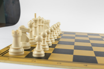 White chess figures on the chessboard