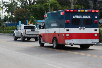 Fototapeta na wymiar Sosua. Dominican Republic. Emergency ambulance car rides on the road.