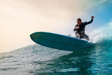 Surfer riding waves on the island of fuerteventura