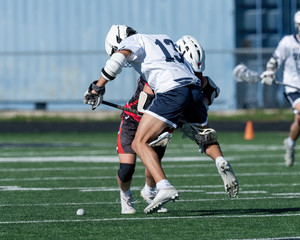 Young athletes making amazing plays while playing in a Lacrosse game