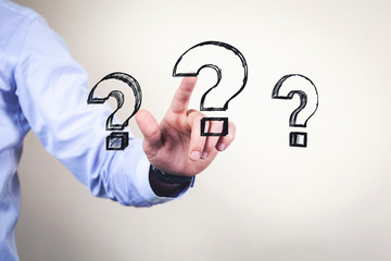 man touching in question mark