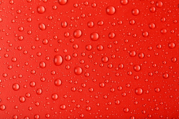 Water drops on red background