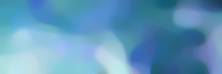 blurred bokeh landscape format background texture with steel blue, light blue and sky blue colors and free text space