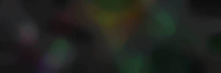 unfocused landscape format background with very dark green and very dark blue colors and space for text or image