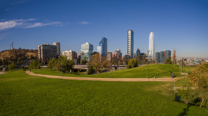 Aerial view of road jungtion and Manquehue hill from Vitacura bicentennial park on a clear day in Chilean capital Santiago