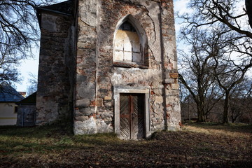 Fototapeta premium Door of an abandoned and decayed church