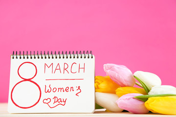 Text 8 March Womens Day with tulip flowers on pink background