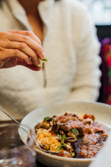 Squeezing Lime Wedge on Food