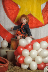 little red-haired girl and balloons, vintage circus