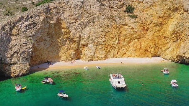 Tourists on Golden Bay Beach on Krk Island in Adriatic Sea in Croatia, Aerial