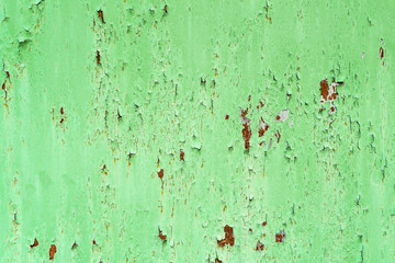 photo of metal with old paint. rust under the paint.