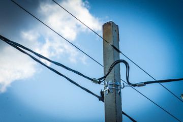 Power pole. Photo of a pole with electric wires against the sky.