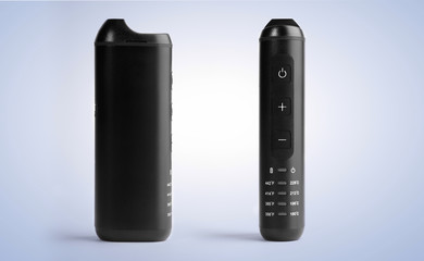 Front and side view of black modern electronic herb vaporizer on blue background