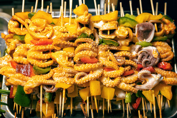 Baby octopus skewers with vegetables at night market in Phu Quoc, Vietnam