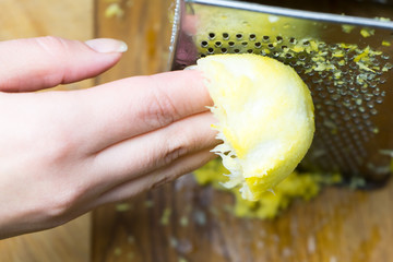 Removing the zest from the lemon. an ingredient for delicious dishes.