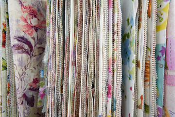 Display stand with the sale of different curtains in the store. Close-up