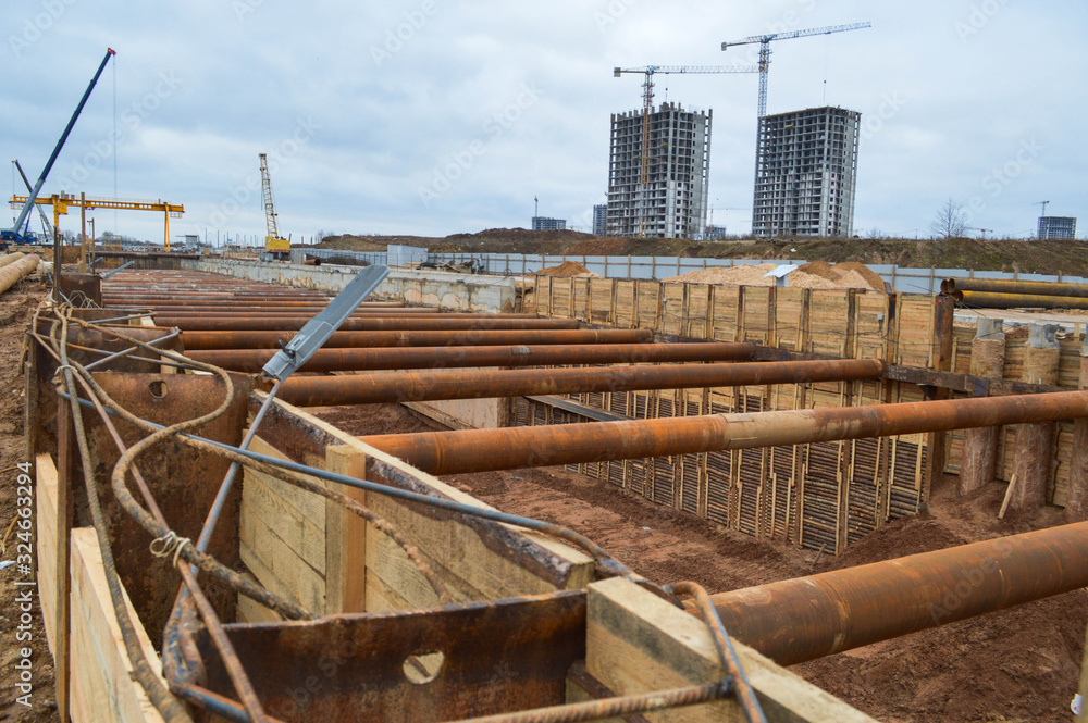 Poster a large huge ditch pit tunnel with reinforcing structures from thick iron pipes of beams and structu