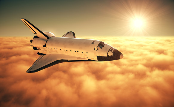 Space Shuttle Above The Clouds During Sunrise
