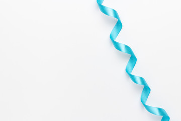 A light blue ribbon on a white background.