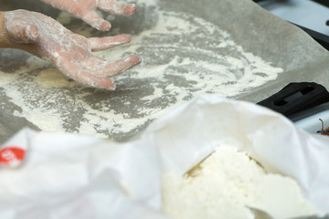 Hands in flour. Homemade cake. Cooking in the kitchen.