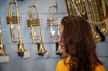 playing jazz music. Alto sax musical instrument. Saxophone player. classical music performances. play various instruments. wind instruments. Woman trumpeter playing Jazz musician with brass instrumen - Powered by Adobe