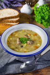 Polish barley soup with vegetables and chicken heart.