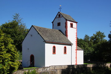 Fototapeta premium Small romanesque village church of Gentingen, Eifel region in Germany