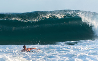 Surfer surfing at sunset, Bondi Beach, Sydney