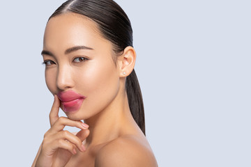 Portrait of delighted girl that doing lip mask
