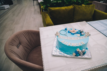 Blue cake with mastic cross and angels for boy christening party. Inscription - Baptism of Alexey.