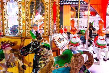 Fototapeta na wymiar amusement park with neon lights at night. children's carousels, lunapark
