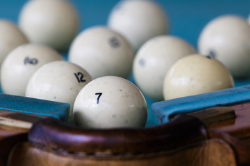 Billiard balls on the playing table.
