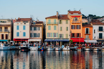 Fototapeta na wymiar Colorful buildings and boats in the port of Cassis, France.