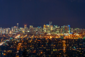 Fototapeta na wymiar Cityscape Night. Evening illumination in Vancouver, Canada.