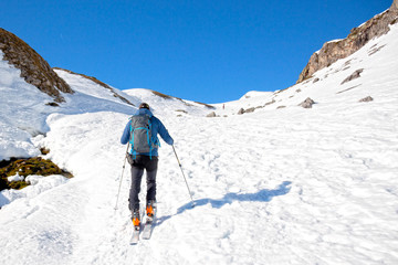Fototapeta na wymiar man making touring ski in Pyrenees mountains in France