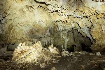 Cave with stalactites growing on the ceiling
