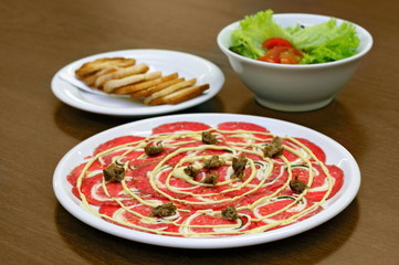 classic carpaccio with toast and salad