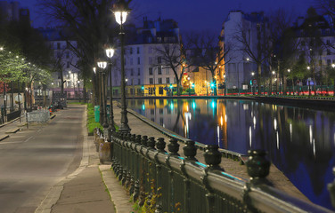 The Canal Saint-Martin at night .It is long canal in Paris, connecting the Canal de l'Ourcq to the...