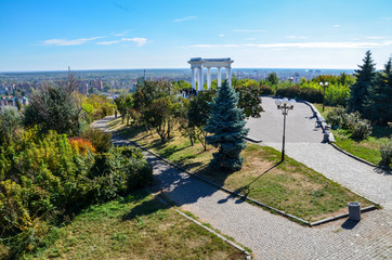 Beautiful and elegant White arbor or rotunda frendship in a park in Poltava, Ukraine