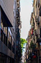 Fototapeta premium Narrow street in the Gothic Quarter of Barcelona. The Gothic Quarter is the centre of the old city of Barcelona. Architecture and details, street view