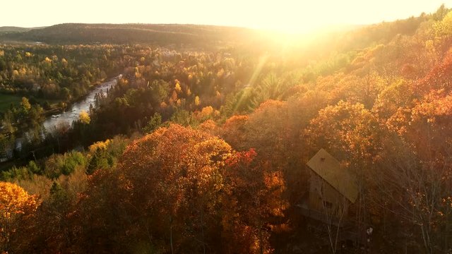 A small wooden cabin in the middle of a beautiful forest. Filmed in Canada during the autumn.