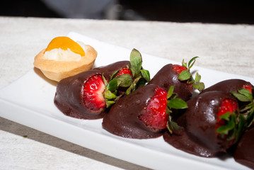 Saucer served with delicious chocolate covered strawberries, appetizer