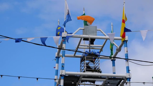 King Puck goat, the centerpiece of traditional Puck Fair festival in Killorglin town in Republic of Ireland. Black male goat is crowned and put into the cage which is raised to the top of the tower fr