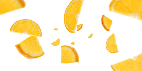 Fototapeta premium Sliced fruit falling background. Orange citrus tangerine flight in air with clipping path.