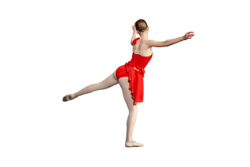 Girl ballerina performs a movement. The girl in the dance. Choreography class. Red dress. Dancer's...