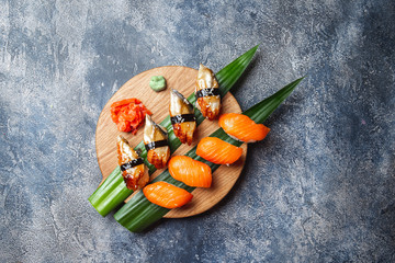 Sashimi sushi set on wooden board. Stone background. Top view © lblinova