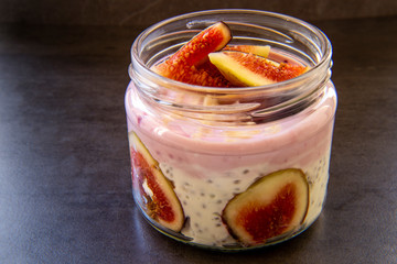 Healthy Chia pudding with yogurt, figs, oats in the jar