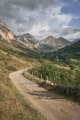 A road runs through a valley in Somiedo (Asturias, Spain)